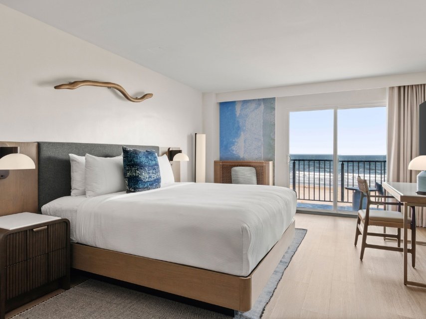 A king bed guestroom with an ocean view at The Seahaus Hotel in Atlantic City NJ