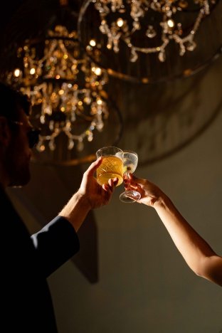 cocktail cheers at Raven Speakeasy located inside Hotel Mockingbird