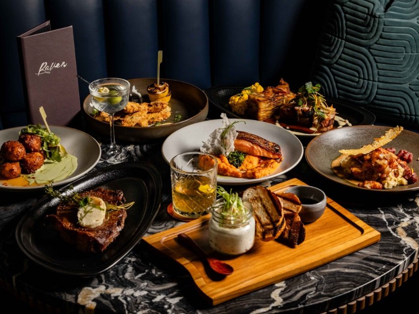 food and beverage spread of Raven Speakeasy located inside Hotel Mockingbird in Dallas, TX